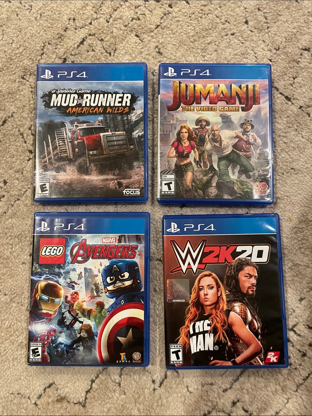 PS4 Game Lot — MudRunner, Jumanji, LEGO Marvel Avengers, WWE 2K20 (Blue Cases)